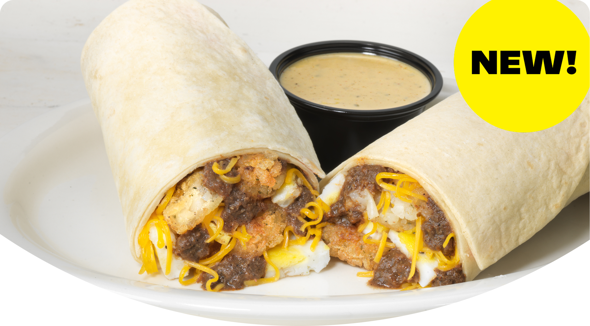Breakfast burrito with eggs, chili, hashbrowns and cheese and a dipping sauce